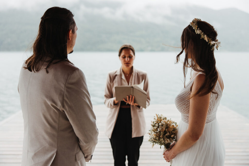 German couple during an elopement ceremony by the Sognefjord in Norway, surrounded by dramatic fjord scenery and natural beauty.